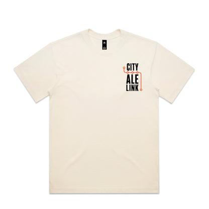 Front of the City Ale Link launch tee: a natural ecru heavyweight box tee with a small left-chest print, the words CITY ALE LINK stacked in black with an orange route line turning around them and five circular stops along it.